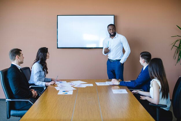 Business meeting with chalkboard