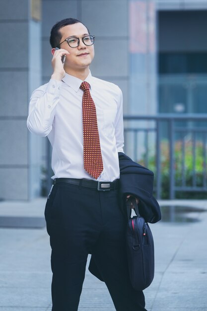 Business men answer phones at the office door