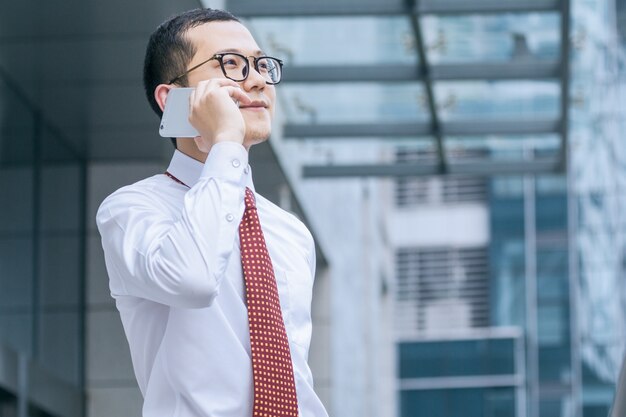 Business men answer phones at the office door