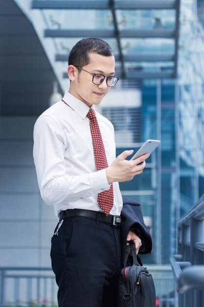 Business men answer phones at the office door