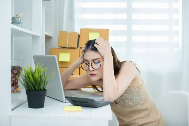 business owner working at home office packaging 