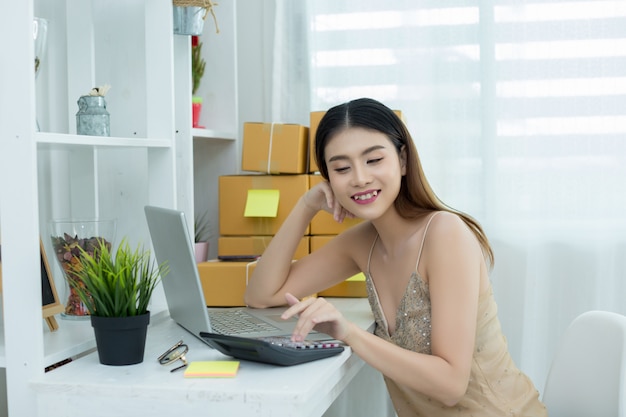 business owner working at home office packaging