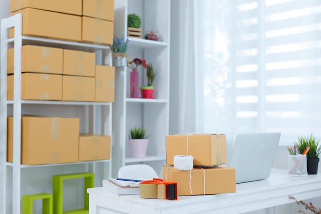 Business owner working at home office packaging