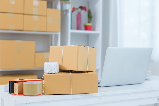 Business owner working at home office packaging