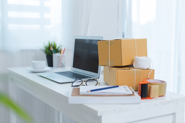 business owner working at home office packaging 