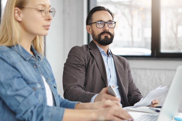 Business partners working in office