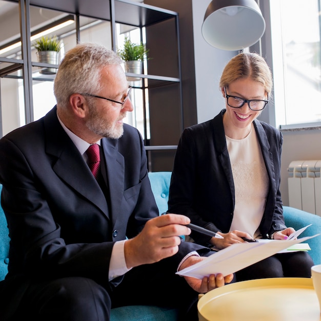 Business people busy discussing financial matter during meeting