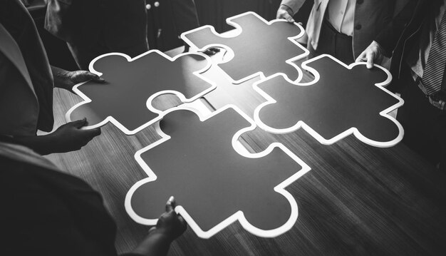 Business people connecting puzzle pieces