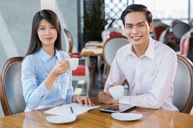 Business People Drinking Coffee in Restaurant