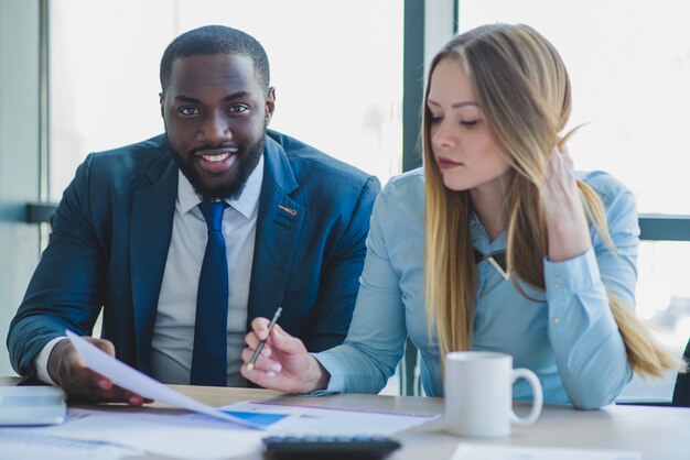 Business people in front of a window