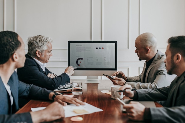 Business people having a conference meeting using a computer