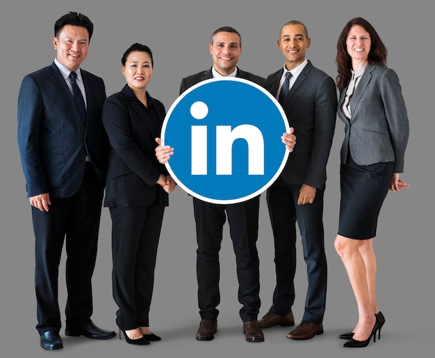 Free photo business people holding a linkedin logo