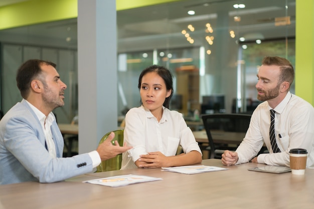 Business people meeting and working at desk in office