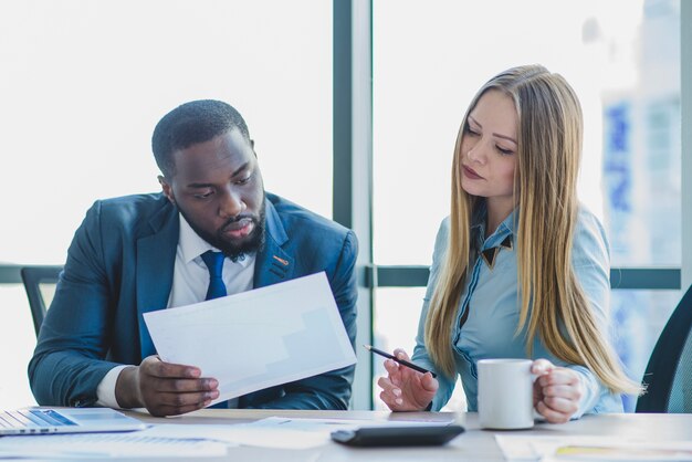 Business people reading a document together