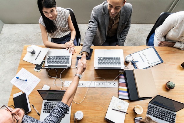 Business people shaking hands in agreement