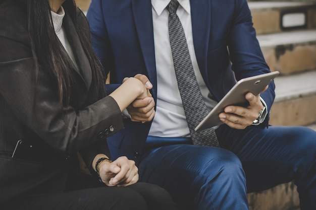 Business people shaking hands, finishing up meeting deals. Business concept.