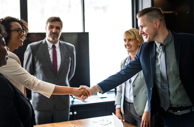 Business people shaking hands in a meeting room