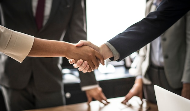 Free Photo business people shaking hands in a meeting room