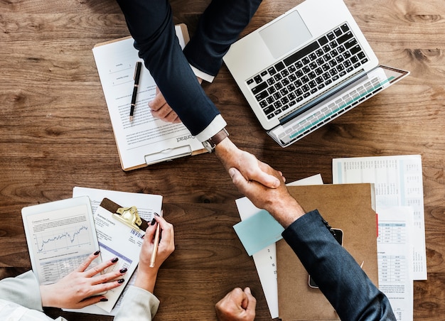 Business people shaking hands together