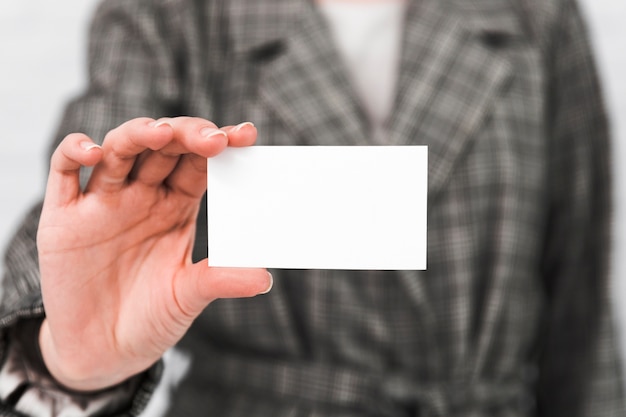 Business people showing blank business card