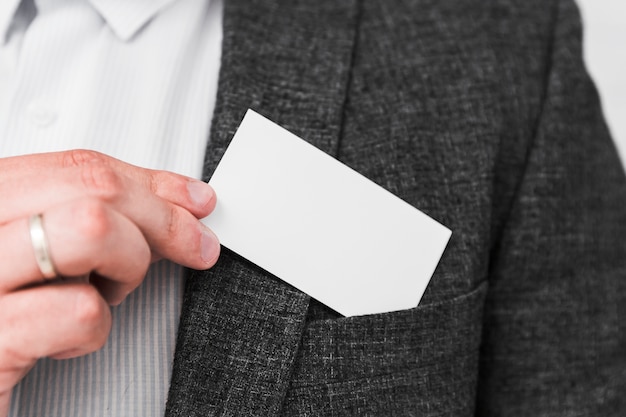Business people showing blank business card