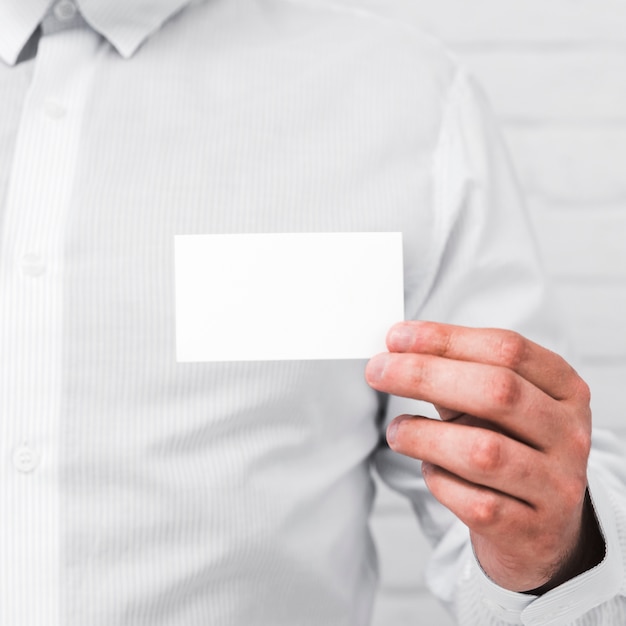 Free photo business people showing blank business card