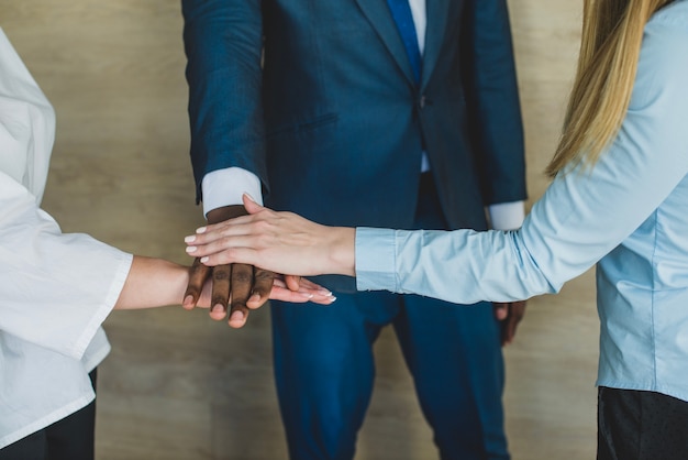 Free photo business people stacking hands