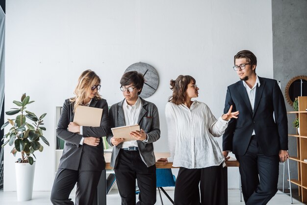 Business People standing in the office discussing