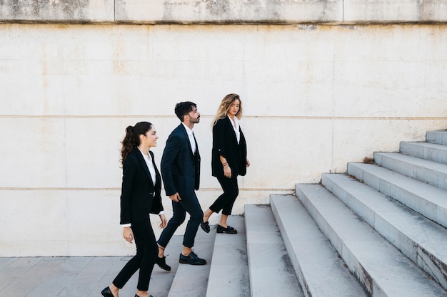 Business people walking upstairs