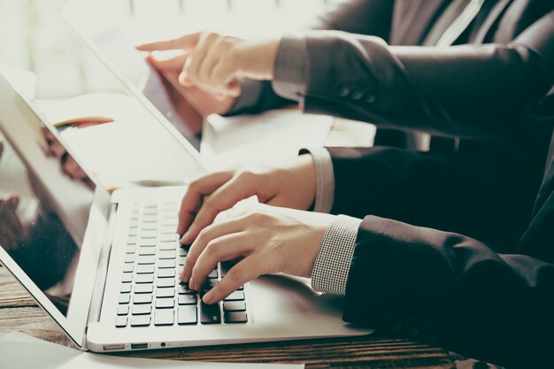 Business people with a laptop and a tablet