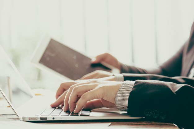 Business people with a laptop and a tablet