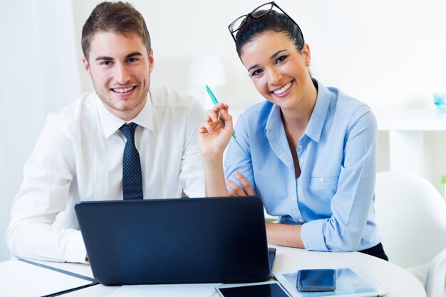 Business people working in the office with laptop.