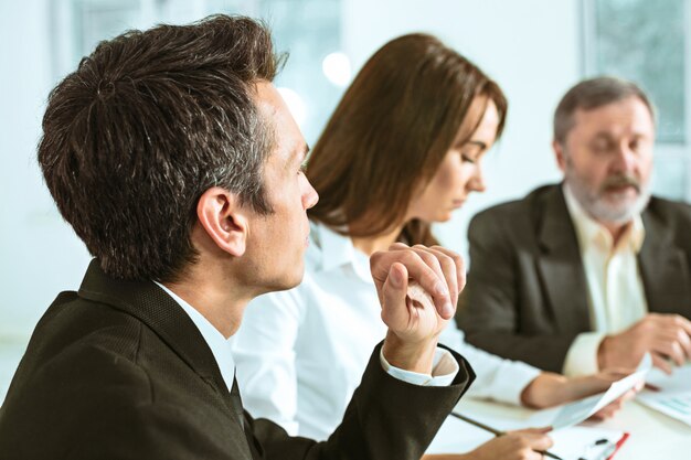 The business people working together at table.