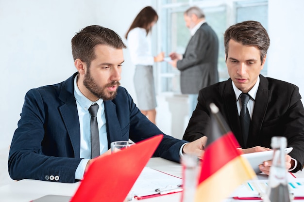 The business people working together at table.