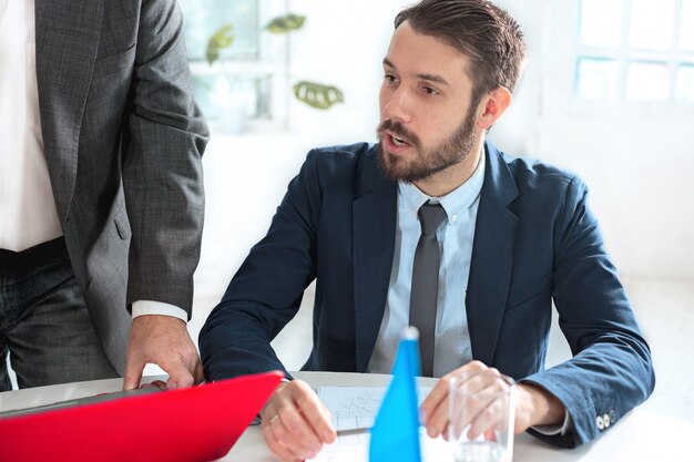 The business people working together at table.