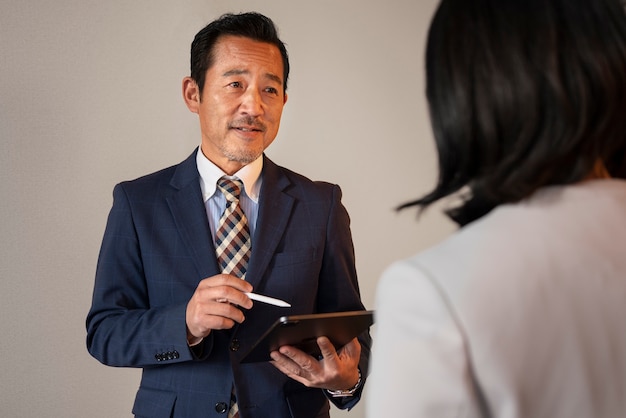 Business people working with ipad front view