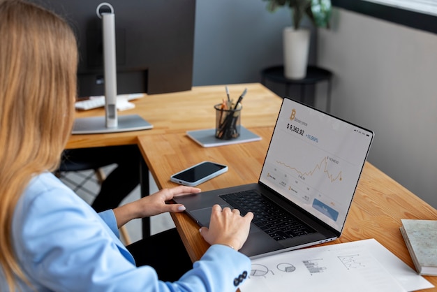Business person looking at finance graphs