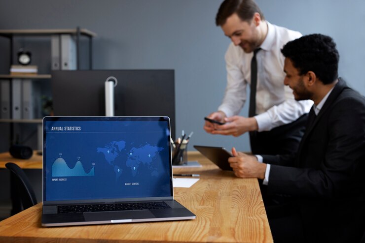 Free Photo business person looking at finance graphs