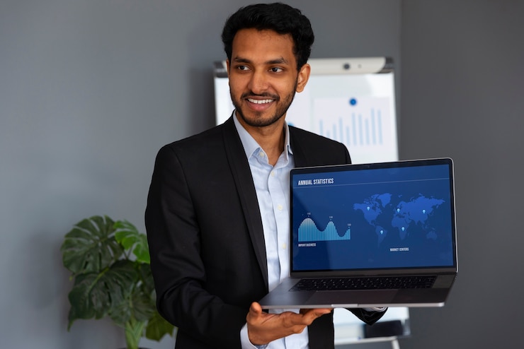 Free Photo business person looking at finance graphs