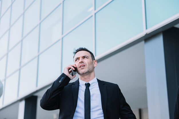 Business person phoning outside