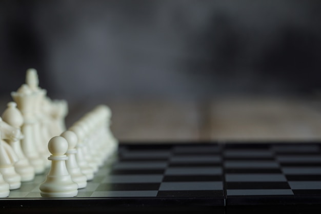 Free photo business strategy concept with chessboard with figures side view.