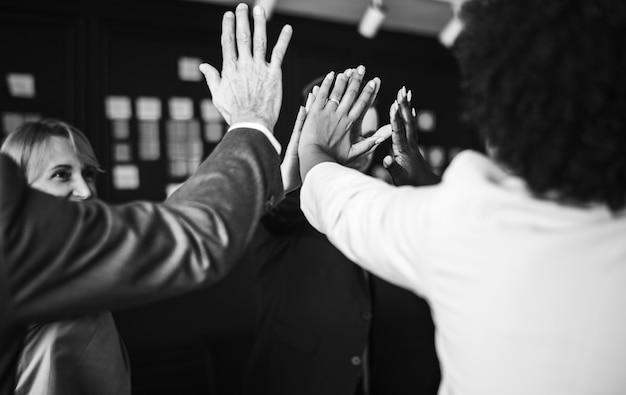 Business team giving a high five