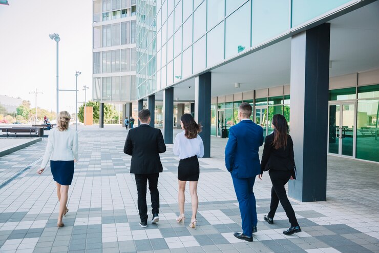 Free Photo business team walking in street