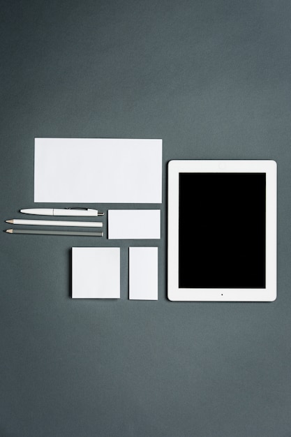 Free Photo business template with cards, papers, tablet. gray space.