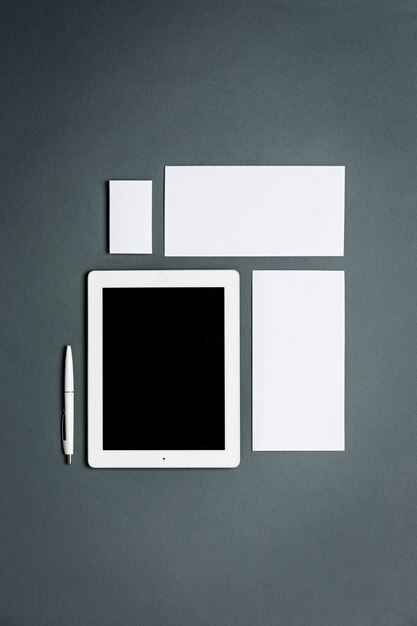 business template with cards, papers, tablet. Gray space.