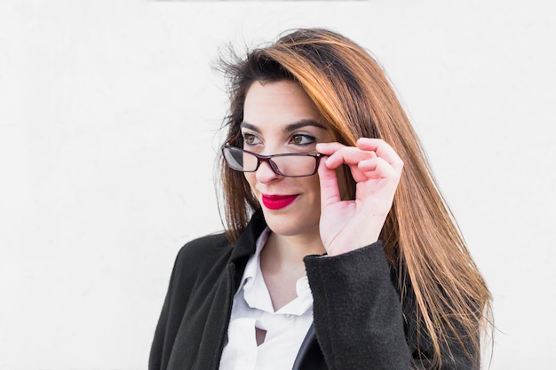 Business woman adjusting glasses