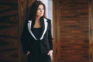 Free photo business woman in black suit