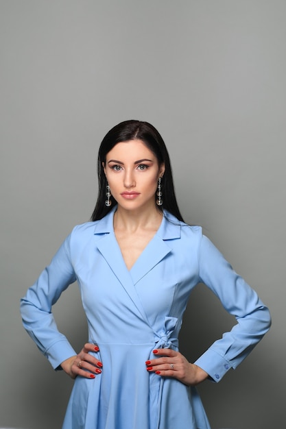 Business woman in blue strict dress and natural makeup