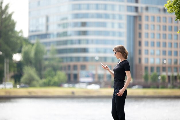 Business woman on cellphone in the street