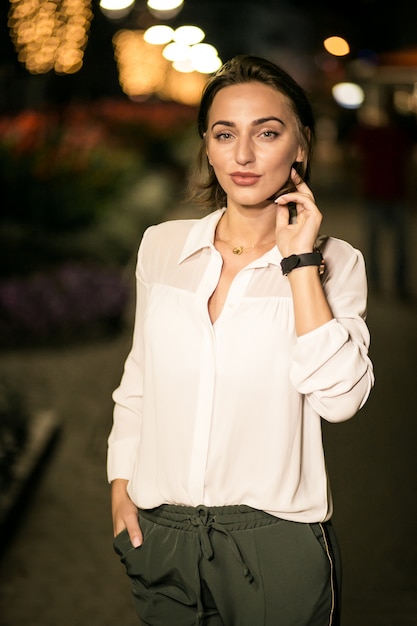 Business woman in the evening street